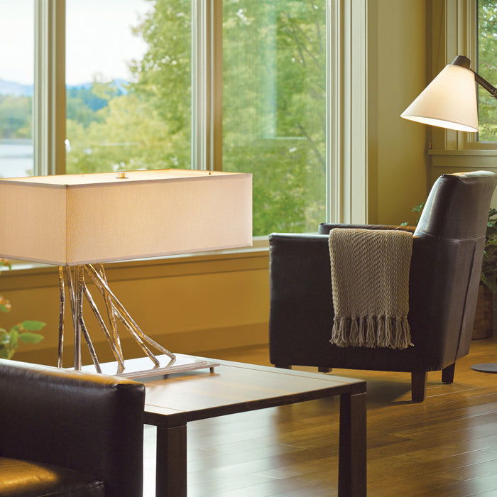 A contemporary table lamp showcased on a side table.