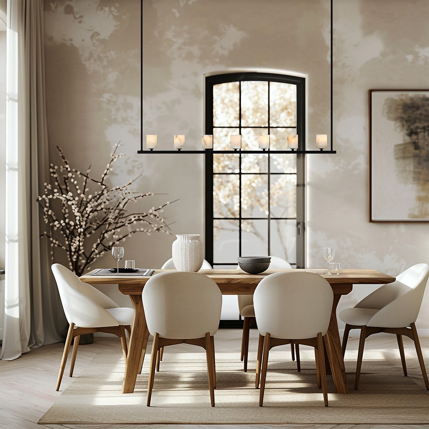 A linear transitional style chandelier above a table in a mission style dining room.