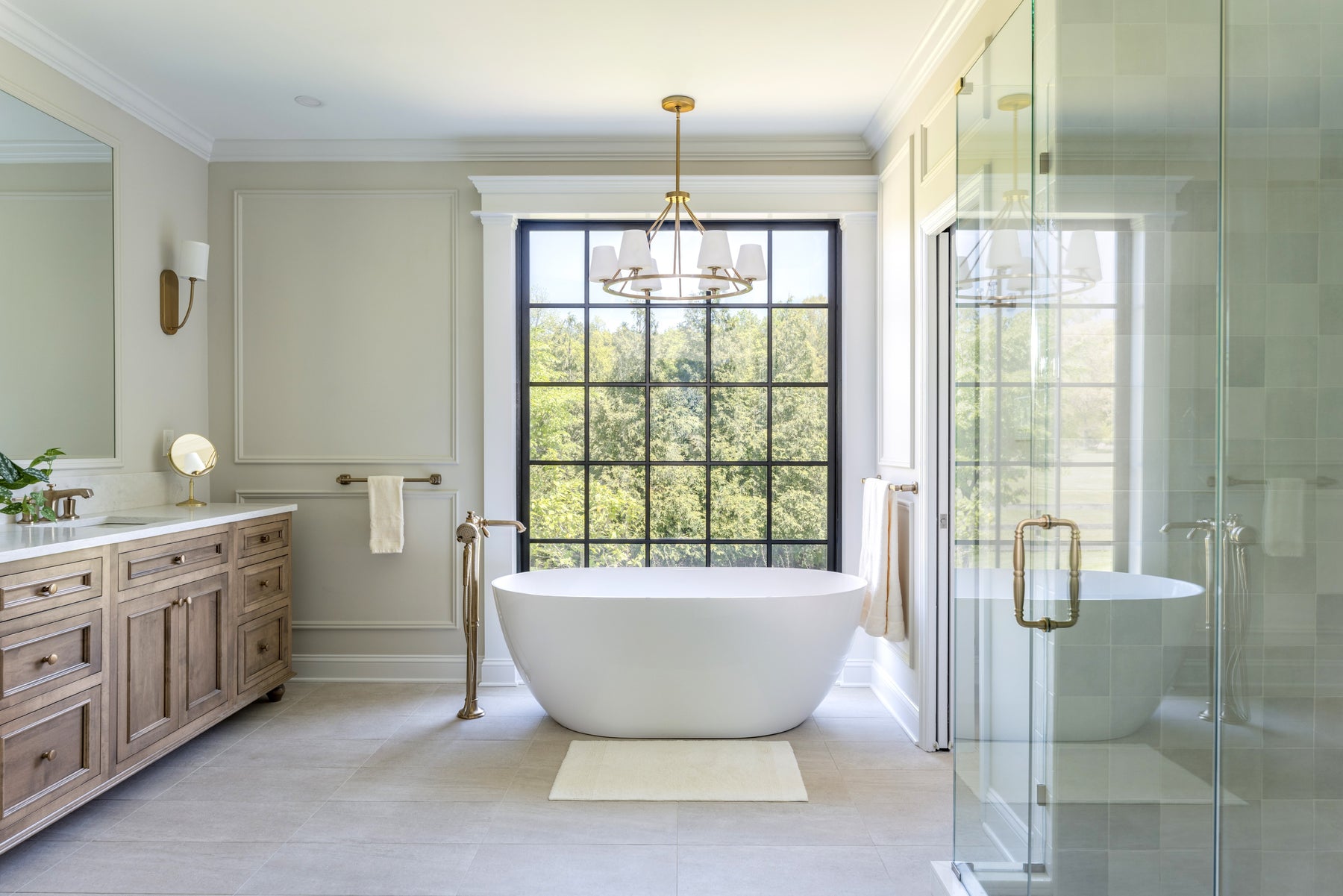 Transitional style bathroom lighting fixtures showcased in a modern bathroom.