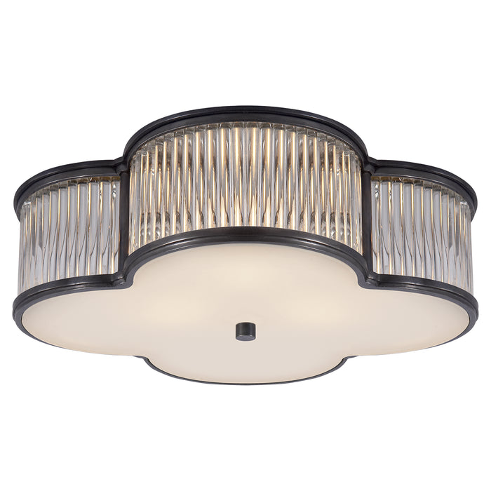 Basil Three Light Flush Mount in Gun Metal with Clear Glass