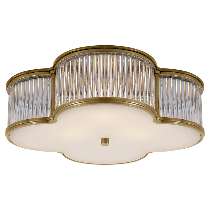 Basil Three Light Flush Mount in Natural Brass with Clear Glass