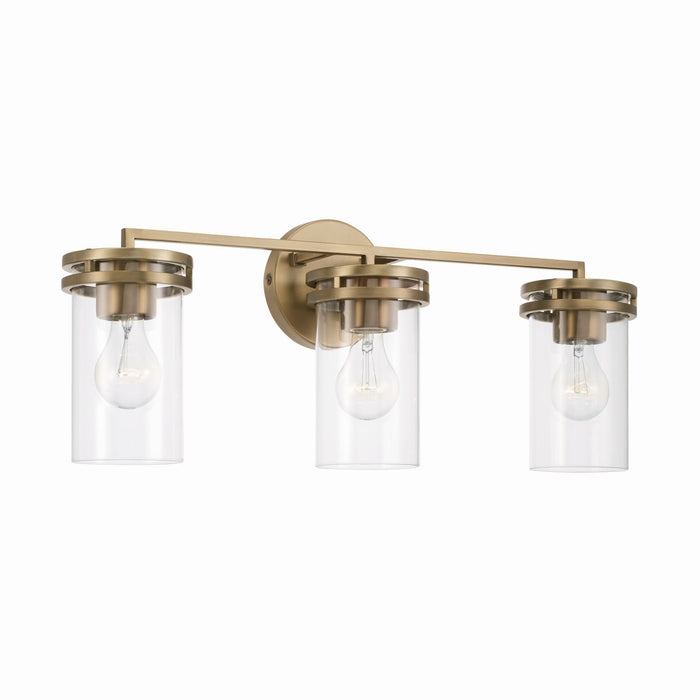 Fuller Three Light Vanity in Aged Brass